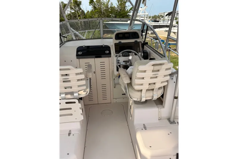 Slide: The Image of 2008 Grady-White Seafarer 226 boat interior with helm and seating. - 3