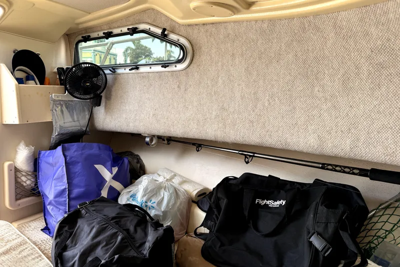 Slide: The Image of Interior of 2008 Grady-White Seafarer 226 with bags and fishing rod. - 12