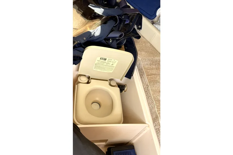 Slide: The Image of Portable toilet on 2008 Grady-White Seafarer 226 boat interior. - 11