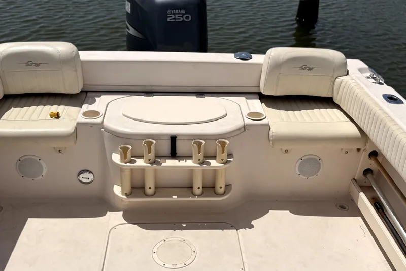 Slide: The Image of 2008 Grady-White Seafarer 226 boat interior with Yamaha 250 engine, rod holders, and seating. - 5