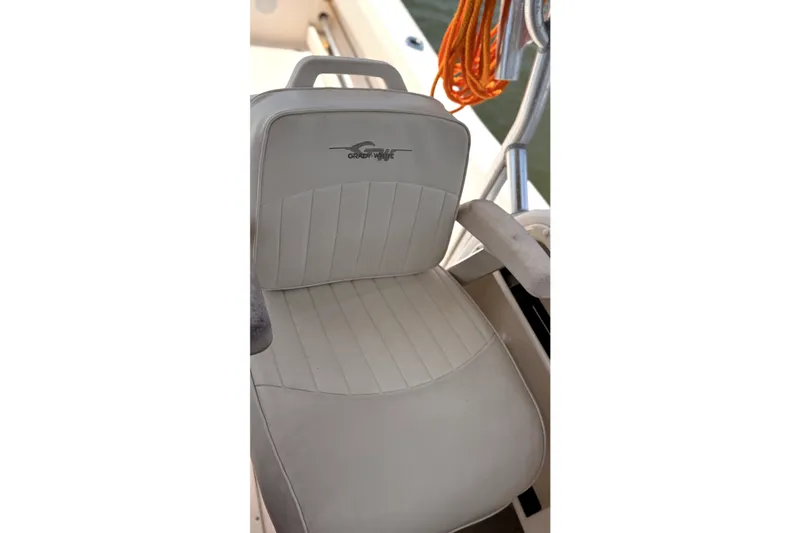 Slide: The Image of Captain's chair on 2008 Grady-White Seafarer 226 boat, featuring logo and sleek design. - 7
