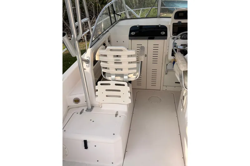 Slide: The Image of 2008 Grady-White Seafarer 226 boat interior with seating and steering area. - 4