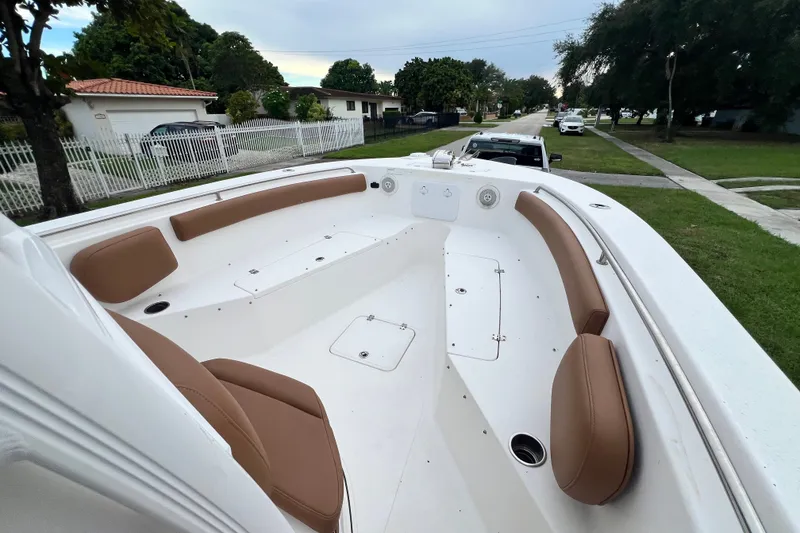 Slide: The Image of 2015 Tidewater 250 CC Adventure boat with spacious seating and sleek design. - 63