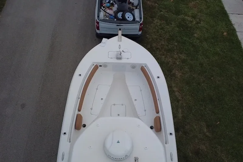 Slide: The Image of Overhead view of a 2015 Tidewater 250 CC Adventure boat on a trailer. - 75