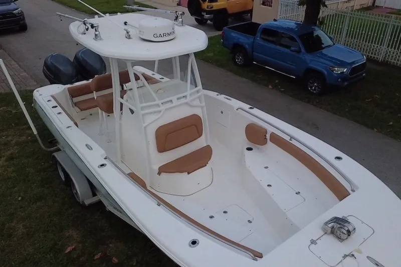 Slide: The Image of 2015 Tidewater 250 CC Adventure boat with dual engines and spacious seating. - 74