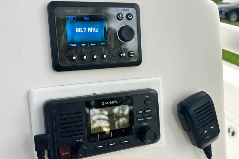 Slide: The Image of Control panel of a 2015 Tidewater 250 CC Adventure boat with radio and Garmin devices. - 44