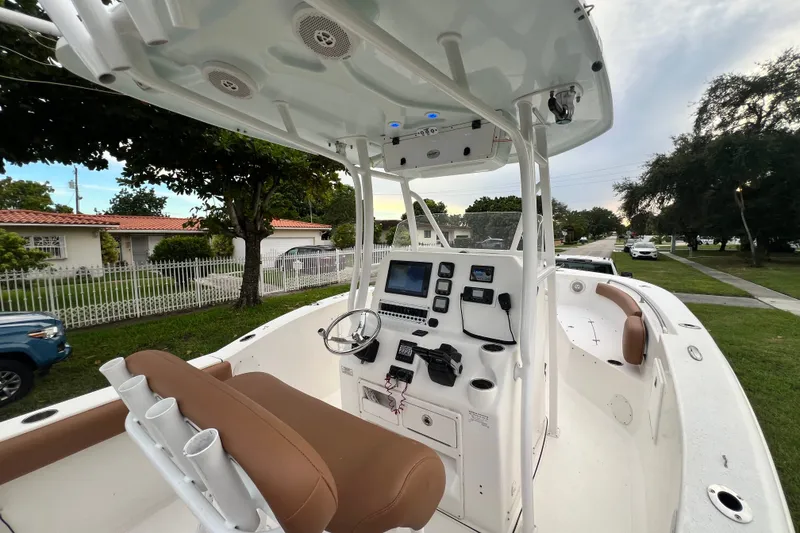 Slide: The Image of 2015 Tidewater 250 CC Adventure boat interior with helm and seating. - 40