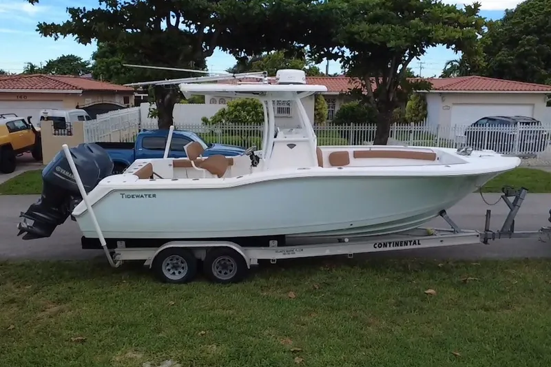 Slide: The Image of 2015 Tidewater 250 CC Adventure boat on trailer in residential area. - 72