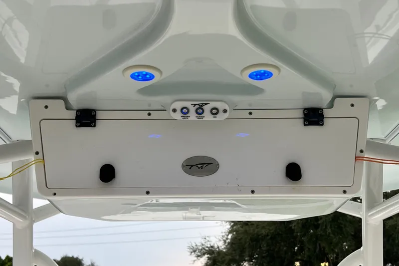 Slide: The Image of Tidewater 250 CC Adventure 2015 boat console with blue LED lights and control panel. - 36