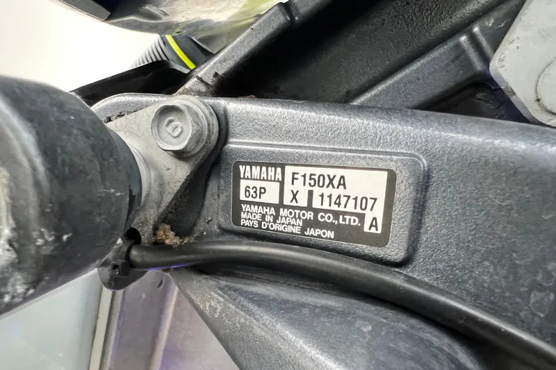 Slide: The Image of Yamaha F150XA engine label on 2015 Tidewater 250 CC Adventure boat. - 14
