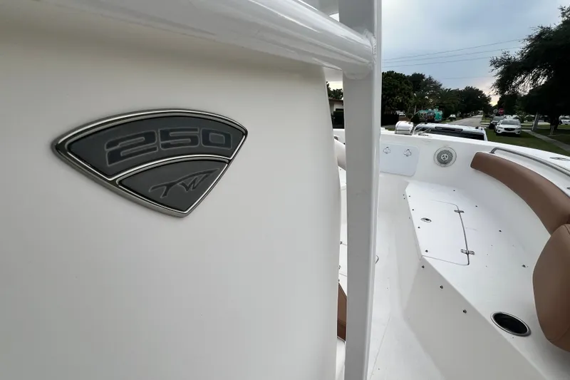 Slide: The Image of 2015 Tidewater 250 CC Adventure boat interior with logo detail. - 32