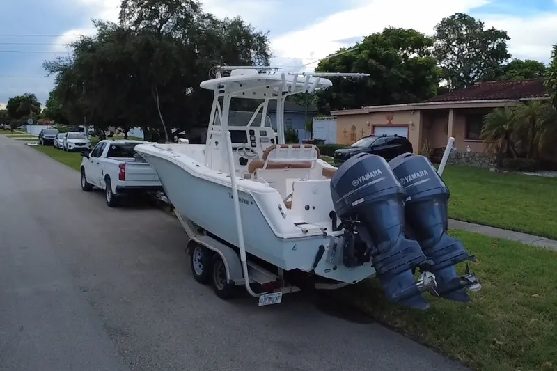 Slide: The Image of 2015 Tidewater 250 CC Adventure boat with twin Yamaha engines on trailer. - 66