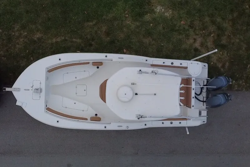 Slide: The Image of Overhead view of 2015 Tidewater 250 CC Adventure boat on grass. - 76