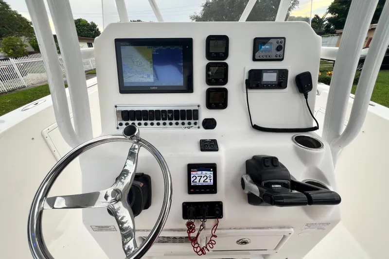 Slide: The Image of Control panel of a 2015 Tidewater 250 CC Adventure boat with navigation equipment. - 49