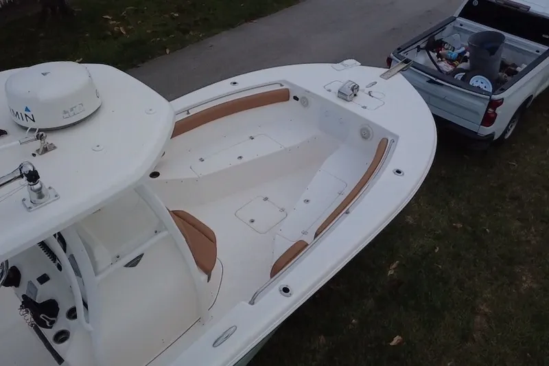 Slide: The Image of 2015 Tidewater 250 CC Adventure boat hitched to a pickup truck, ready for transport. - 67