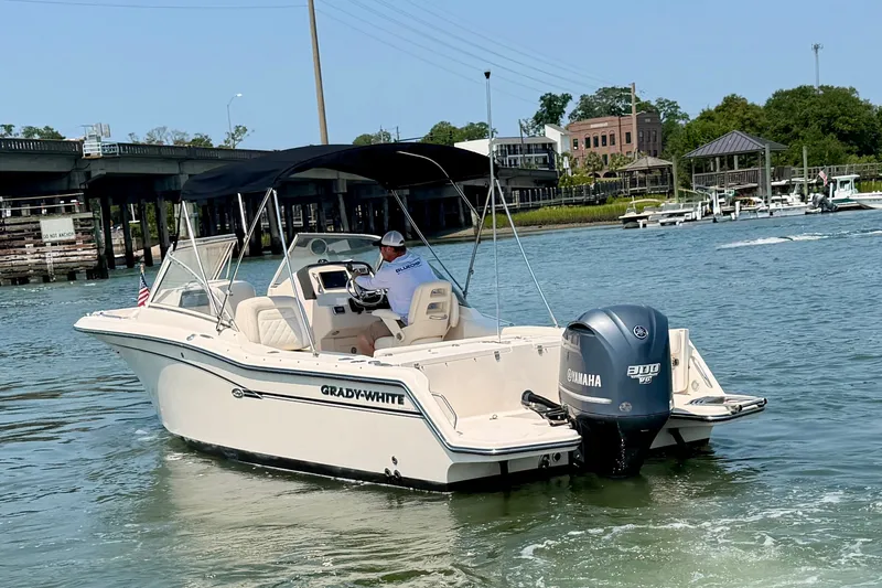 Slide: The Image of 2017 Grady-White Freedom 235 boat cruising on a scenic waterway. - 5