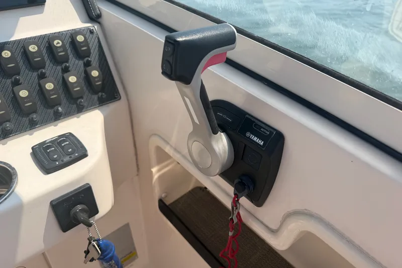 Slide: The Image of Control panel of a 2017 Grady-White Freedom 235 boat with Yamaha throttle. - 29