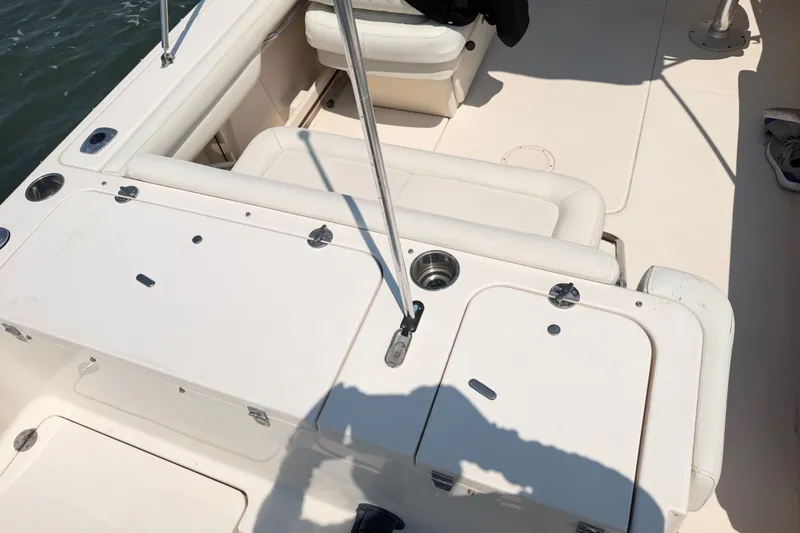 Slide: The Image of 2017 Grady-White Freedom 235 boat interior with seating and storage compartments. - 42