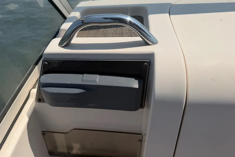 Slide: The Image of Control panel on a 2017 Grady-White Freedom 235 boat, featuring a Fusion audio system. - 40