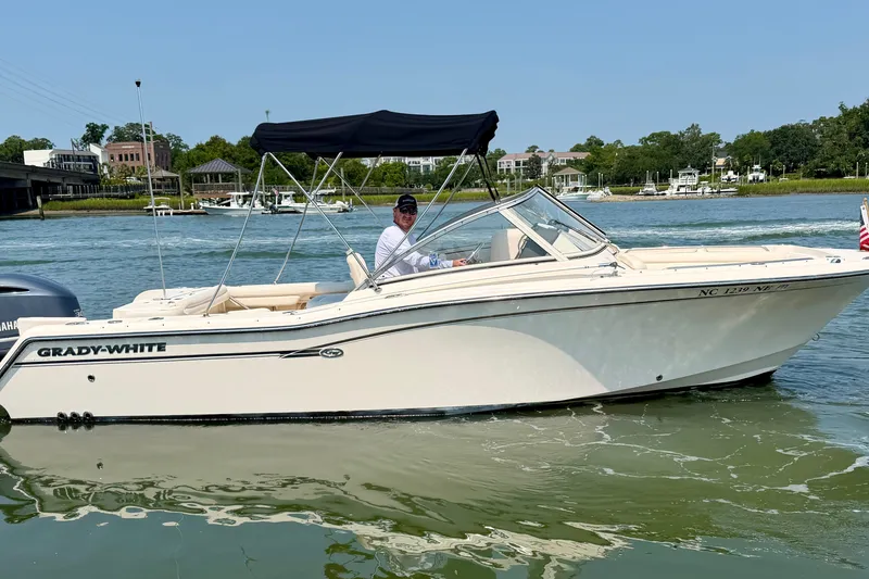 Slide: The Image of 2017 Grady-White Freedom 235 boat cruising on a sunny day. - 0