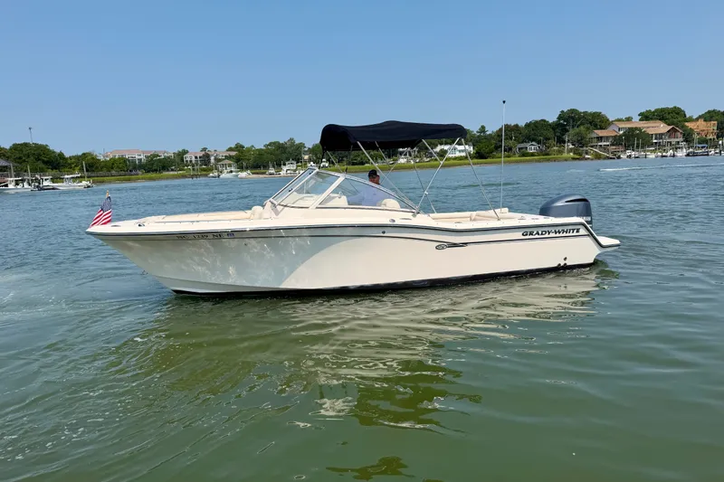 Slide: The Image of 2017 Grady-White Freedom 235 boat cruising on a sunny day in calm waters. - 9