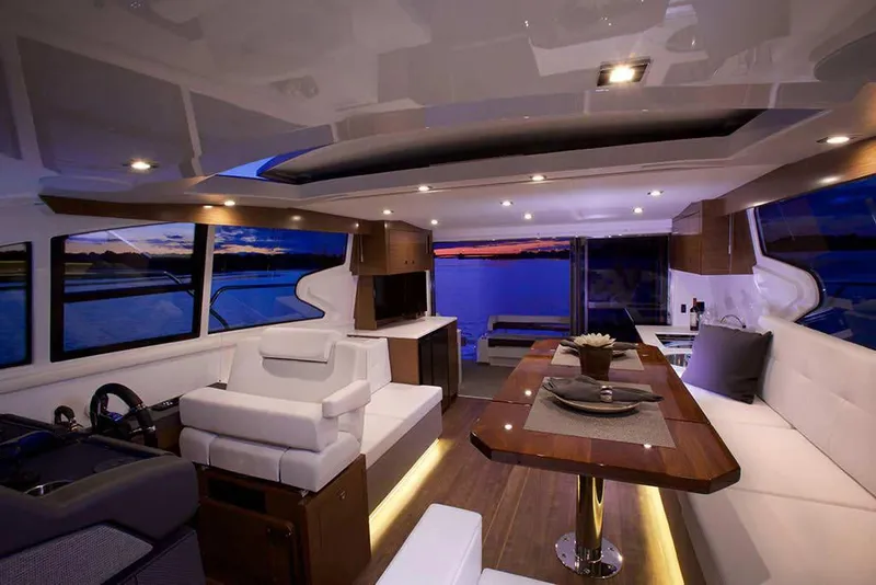Slide: The Image of Manufacturer Provided Image: Luxurious interior of 2022 Cruisers Yachts 46 Cantius at sunset. - 6