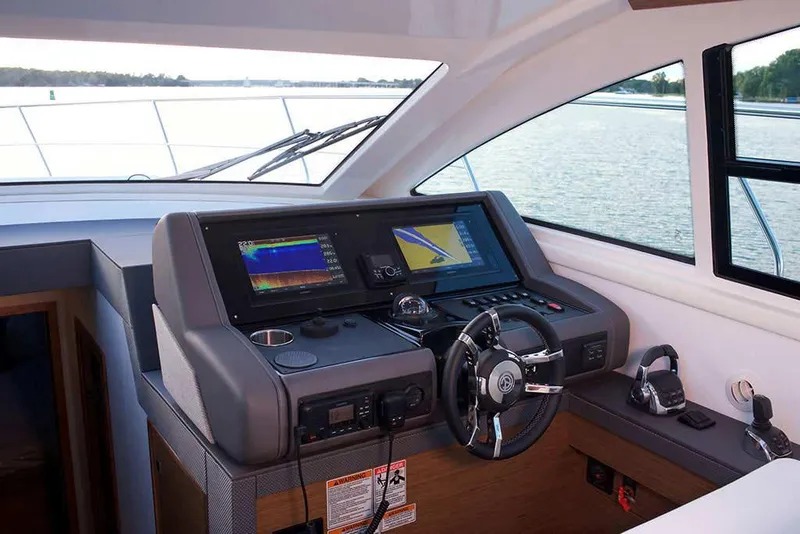 Slide: The Image of Manufacturer Provided Image: Modern helm station of 2022 Cruisers Yachts 46 Cantius with advanced navigation systems. - 8