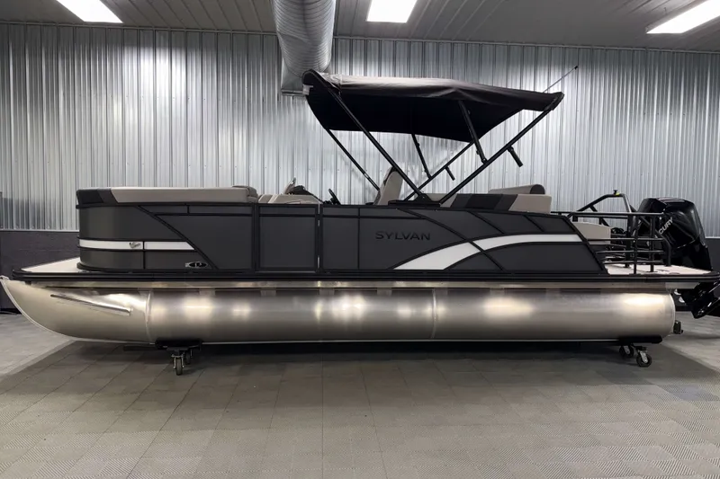 Slide: The Image of 2026 Sylvan L3 CLZ DH Tritoon boat in a showroom, side view. - 23
