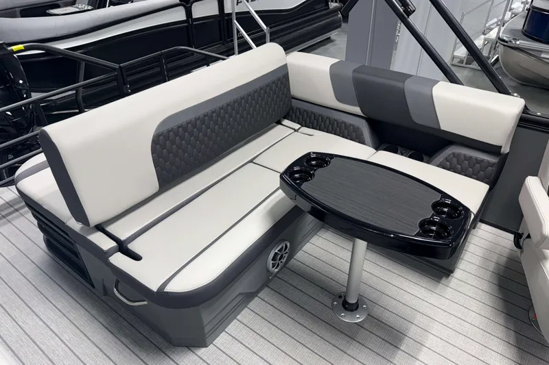 Slide: The Image of 2026 Sylvan L3 CLZ DH Tritoon interior with stylish seating and a sleek table. - 4