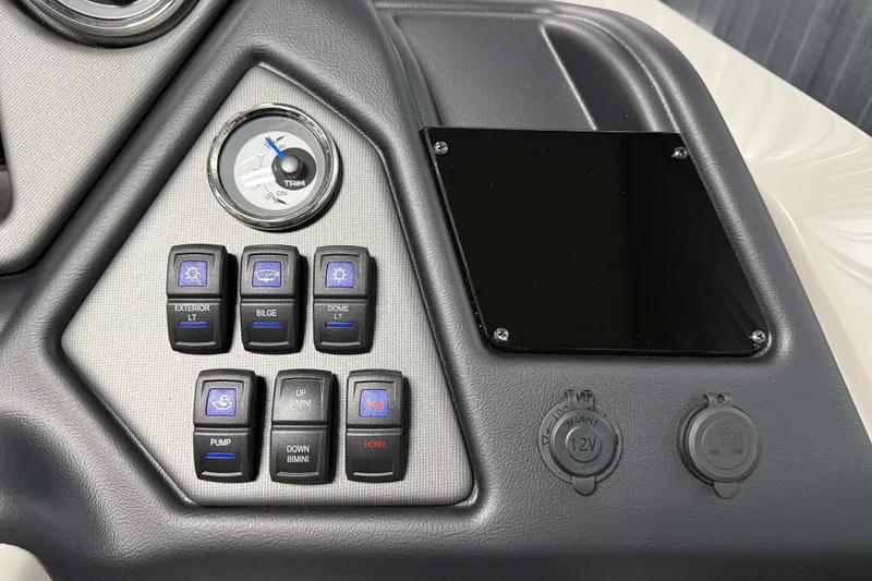Slide: The Image of Control panel of 2026 Sylvan L3 CLZ DH Tritoon with switches and gauge. - 12