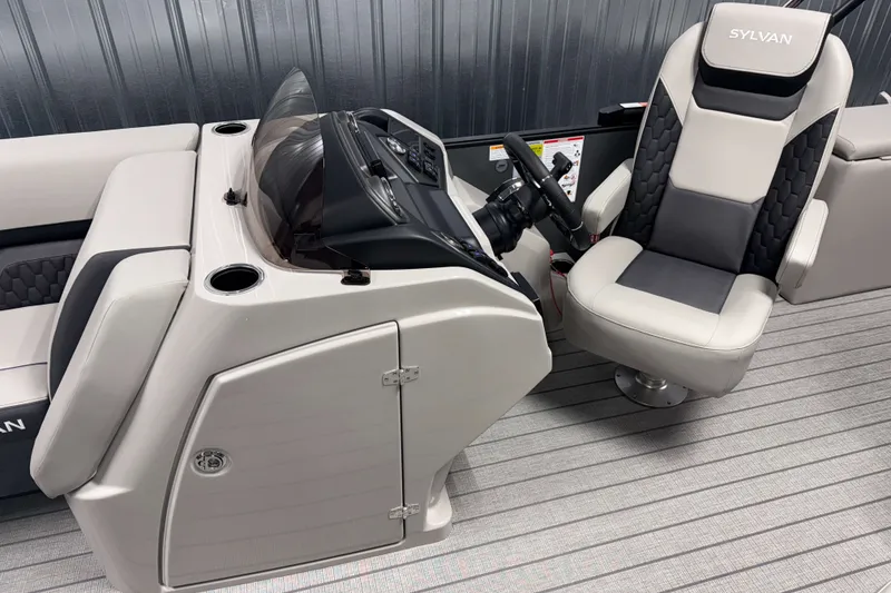 Slide: The Image of 2026 Sylvan L3 CLZ DH Tritoon helm with sleek captain's chair and modern dashboard. - 6