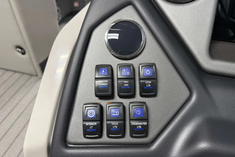 Slide: The Image of Control panel of 2026 Sylvan L3 CLZ DH Tritoon with labeled switches and buttons. - 11
