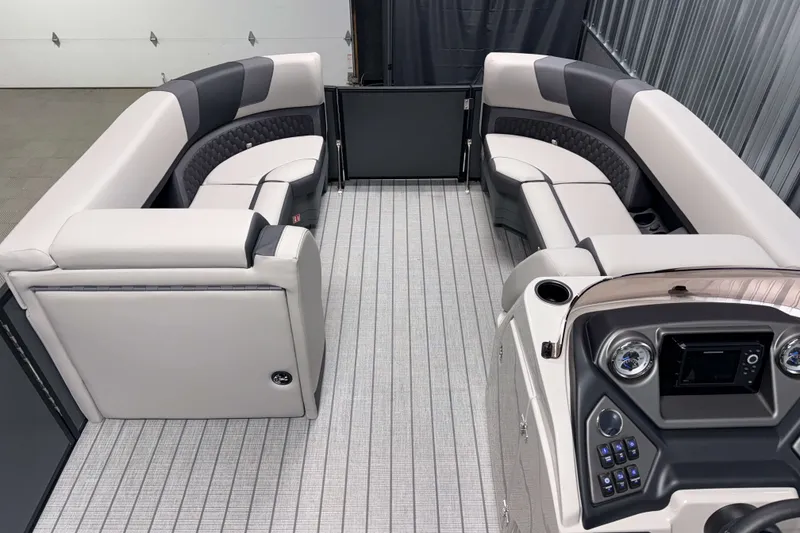 Slide: The Image of Interior of 2026 Sylvan L3 CLZ DH Tritoon with luxurious seating and modern dashboard. - 14
