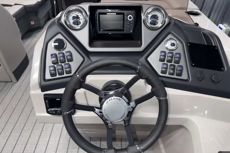 Slide: The Image of Steering console of 2026 Sylvan L3 CLZ DH Tritoon with modern controls and gauges. - 8