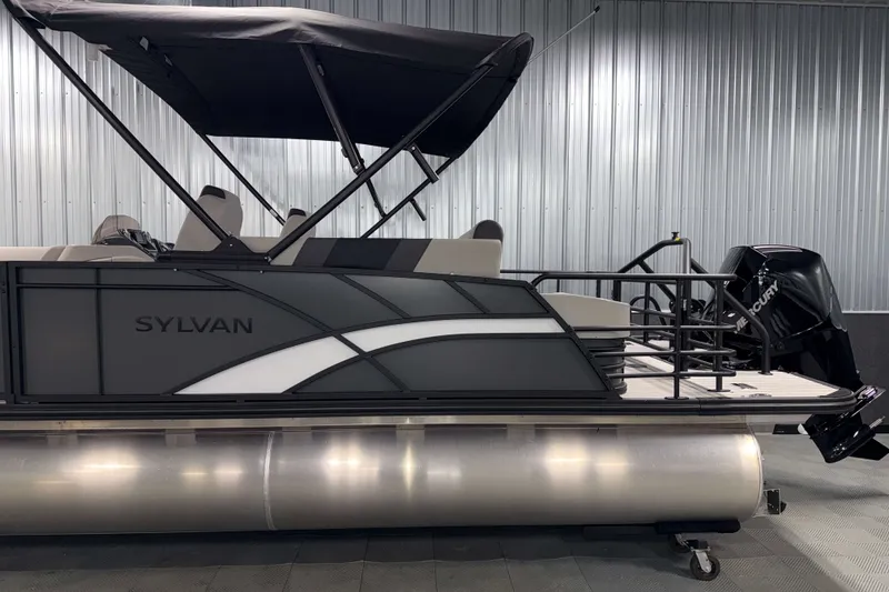 Slide: The Image of 2026 Sylvan L3 CLZ DH Tritoon boat with canopy and Mercury outboard motor. - 24