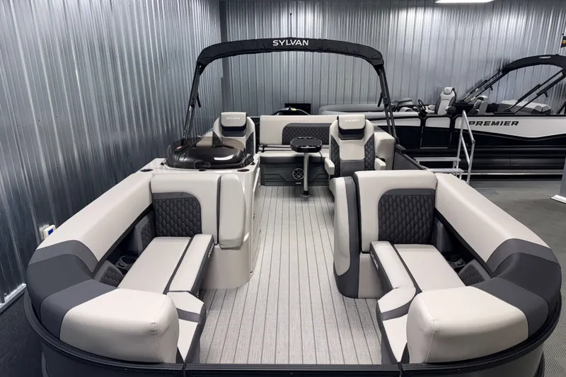 Slide: The Image of 2026 Sylvan L3 CLZ DH Tritoon boat interior with luxurious seating and modern design. - 1
