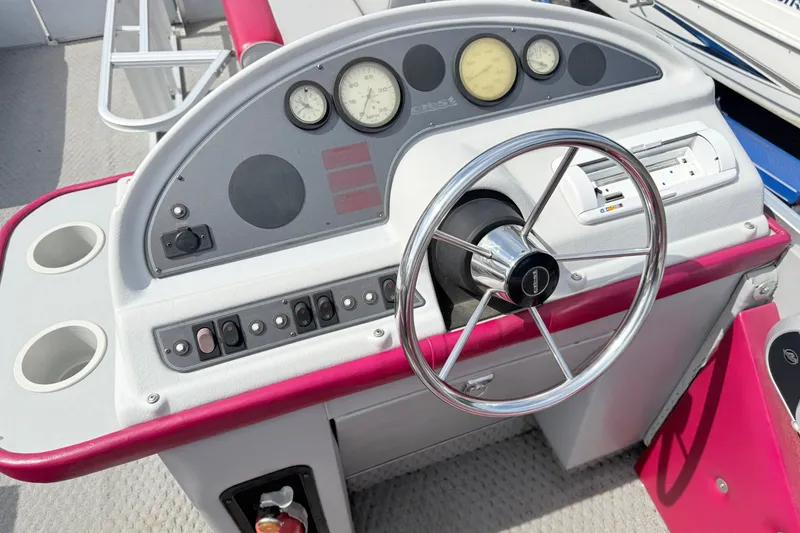 Slide: The Image of Steering console of a 1994 Crest 22 boat with gauges and controls. - 5