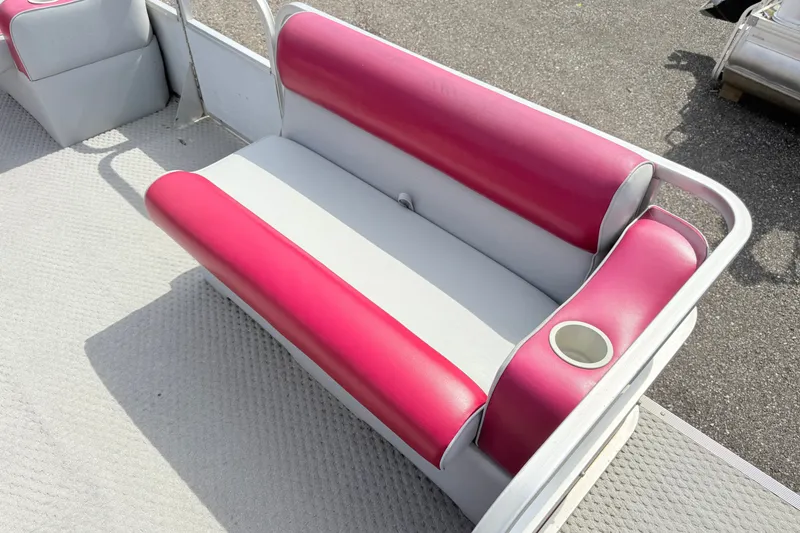 Slide: The Image of Red and white boat seat on a 1994 Crest 22 pontoon. - 8