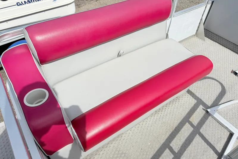 Slide: The Image of Red and white boat seat with cup holder on a 1994 Crest 22. - 9