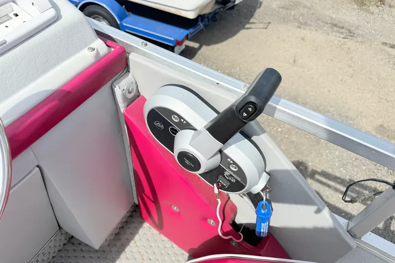 Slide: The Image of Control panel of a 1994 Crest 22 boat with vibrant pink accents. - 6