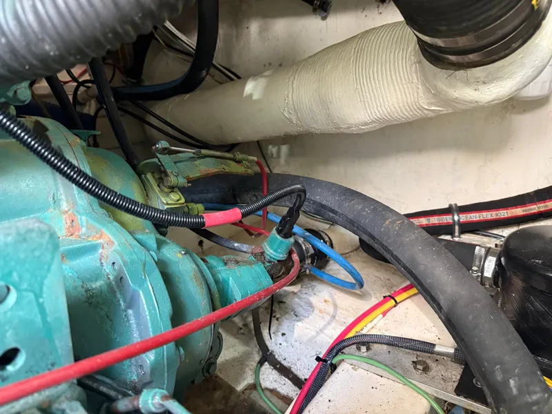 Slide: The Image of Close-up of an engine compartment with hoses and cables. - 49