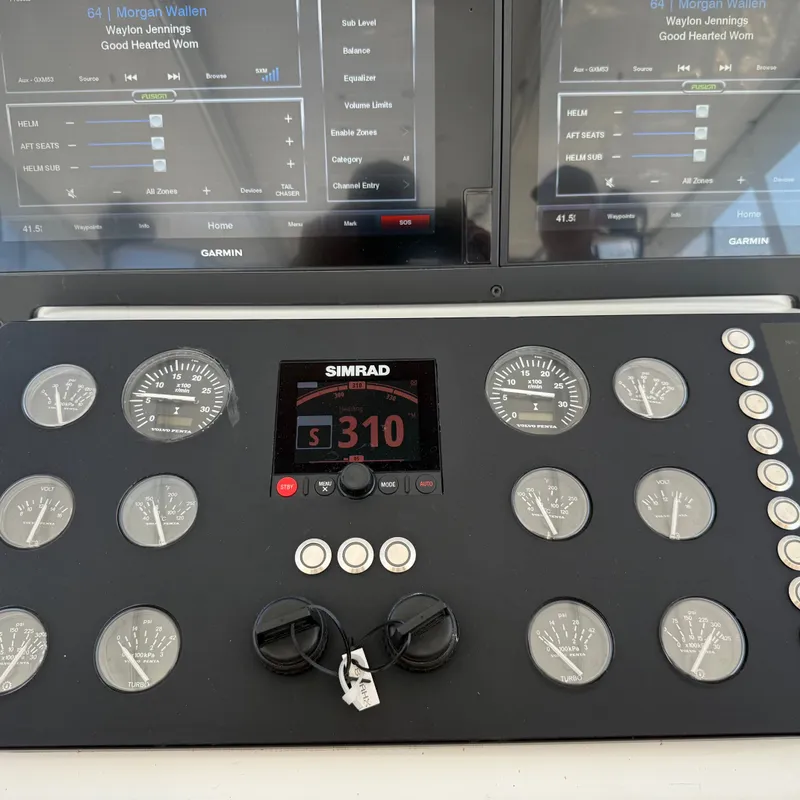 Slide: The Image of The image shows a boat cockpit with Simrad and Garmin equipment. - 25