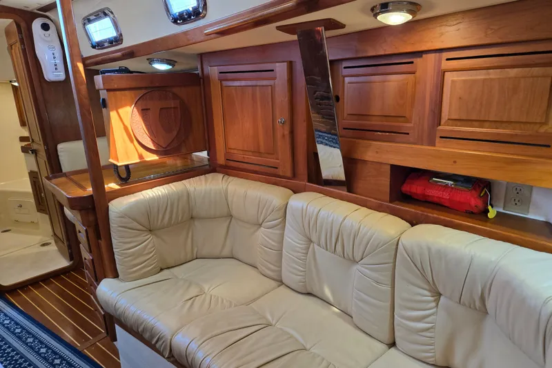 Slide: The Image of Luxurious interior of 2005 Tartan 3700 yacht with leather seating and wooden cabinetry. - 27