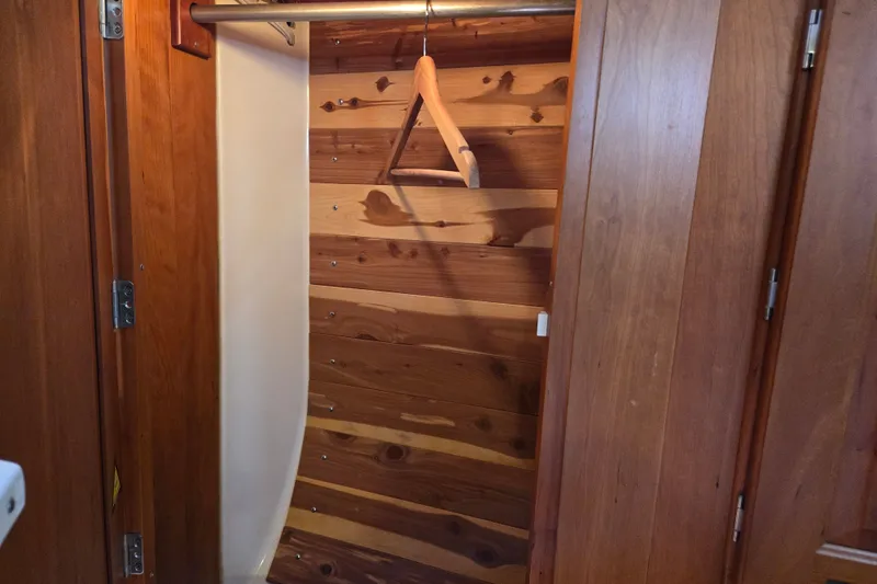 Slide: The Image of Wooden closet interior with a single hanger, Tartan 3700, 2005 model. - 38