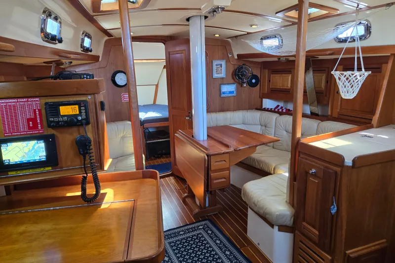 Slide: The Image of Interior of a 2005 Tartan 3700 sailboat with wood finish and navigation equipment. - 20