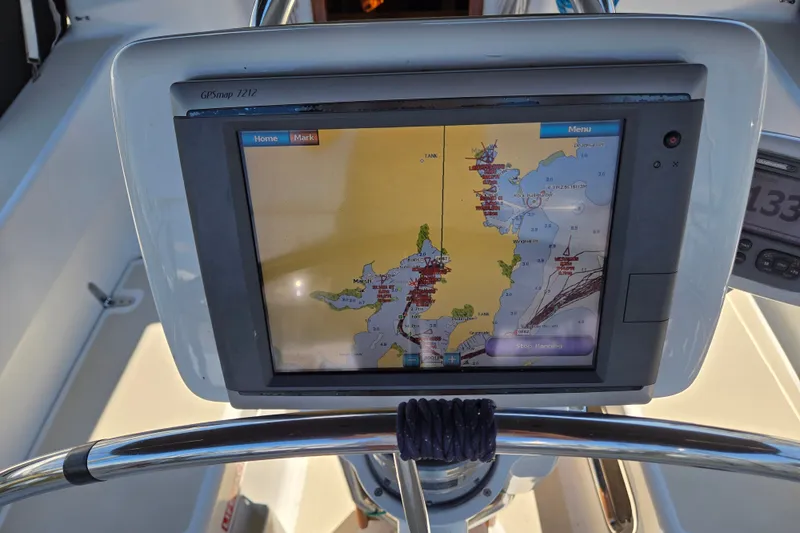Slide: The Image of GPS navigation system on a 2005 Tartan 3700 sailboat, displaying a nautical chart. - 15