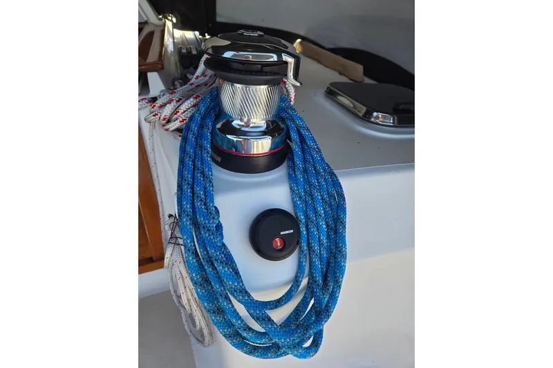 Slide: The Image of Winch with blue rope on 2005 Tartan 3700 sailboat deck. - 18