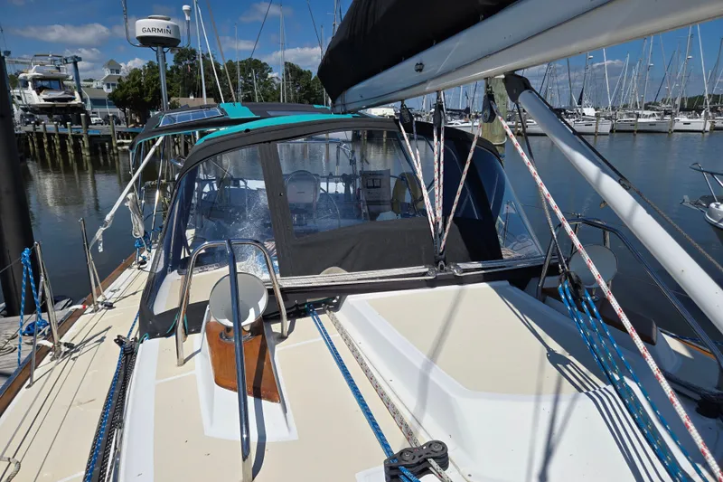 Slide: The Image of Sailboat Tartan 3700 (2005) docked at marina, featuring deck and rigging details. - 12