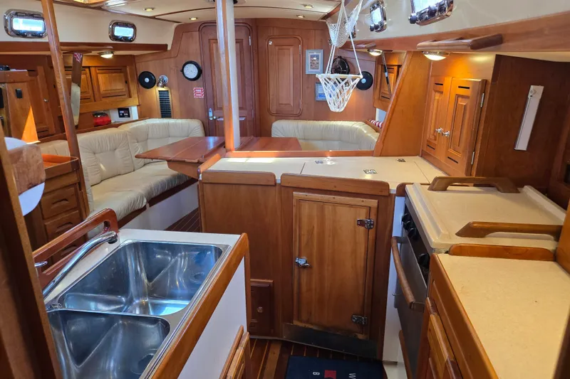 Slide: The Image of Luxurious 2005 Tartan 3700 yacht interior with wood finish and modern amenities. - 36