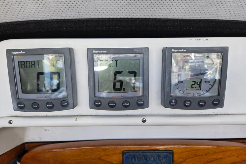 Slide: The Image of Digital marine instruments on a 2005 Tartan 3700 sailboat dashboard displaying speed, depth, and wind data. - 17